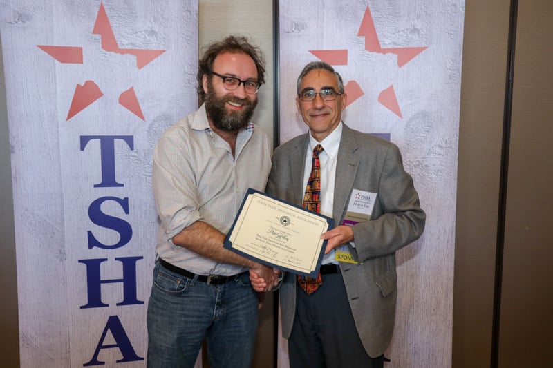 Award being given to recipient during TSHA Annual Meeting